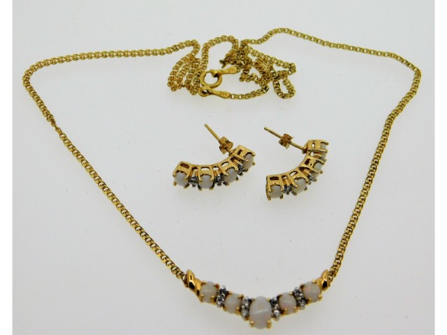 A 14ct gold opal & diamond necklace & earring set,