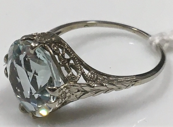A white metal aquamarine ring, electronically tests as 18ct white gold, stone 11mm diameter x 7mm de - Image 2 of 2