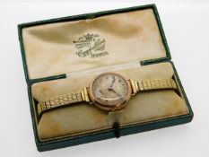 A ladies 9ct gold cased wrist watch with gold inte