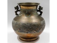 An antique Chinese bronze vase with sea & cloud de