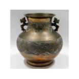 An antique Chinese bronze vase with sea & cloud de