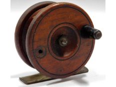 A wooden & brass fishing reel, lacking one handle,