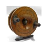 A vintage wooden & brass fishing reel, 113mm diame