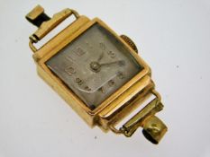 A ladies early 20thC. 18ct gold case wristwatch, 1