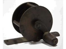 A vintage brass fishing reel, 39mm diameter