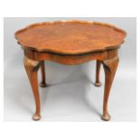 A low level occasional table with burr walnut vene