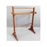 An Edwardian stained towel rack, 31.5in high x 26i