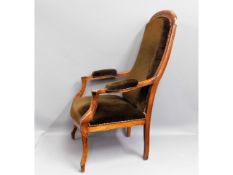 An antique upholstered arm chair, 42.25in high to