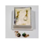 A pair of 9ct gold mounted crystal earrings with o