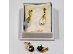 A pair of 9ct gold mounted crystal earrings with o