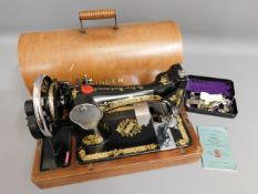 A Singer sewing machine & accessories