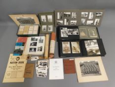 A white metal mounted Ptarmigan claw twinned with vintage photo albums, relating to the Fuge family,