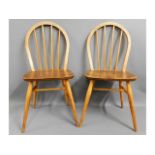 A pair of 1960's Ercol elm dining Windsor style ch