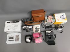 A selection of camera equipment including Canon FX