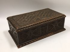 An antique carved box, 11in wide x 6.25in deep x 3