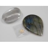 A faceted crystal, possibly rock crystal twinned with a opal & a labradorite tear shaped stone