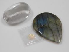 A faceted crystal, possibly rock crystal twinned with a opal & a labradorite tear shaped stone