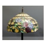 A Tiffany style standard lamp with coloured glass