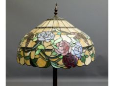 A Tiffany style standard lamp with coloured glass