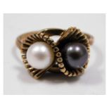 A 9ct gold ring set with pearl, size N. 3.8g