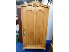 An antique pine wardrobe, 74in high x 18.5in x 39i