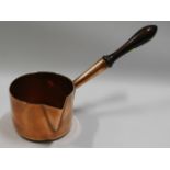 A 19thC. heavy gauge copper milk pan with polished