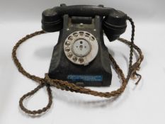 A mid 20thC. bakelite telephone 312L s53/3A