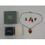 A silver & amber necklace, a pair of silver mounte