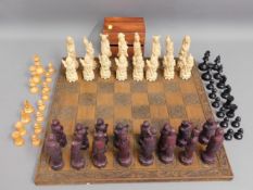 An Oriental chess set, king 5in tall, some faults,