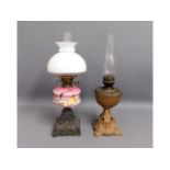 Two antique oil lamps, tallest 23.5in