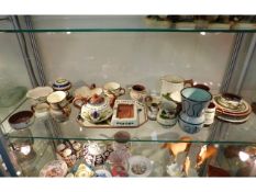 A quantity of Torquay pottery items including adve