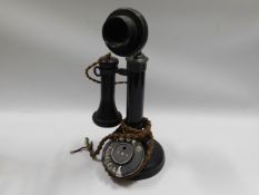 An early/mid 20thC. candlestick telephone with bak