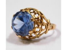 A yellow metal Romany style ring set with topaz, e