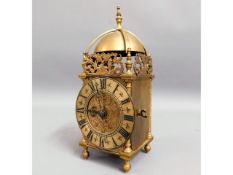 A brass lantern style chiming clock, 10in high