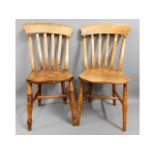 A pair of 19thC. elm farmhouse dining chairs