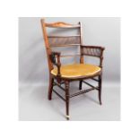 An inlaid Arts & Crafts style walnut armchair, som