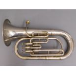A silver plated tuba, some dents