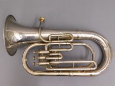 A silver plated tuba, some dents