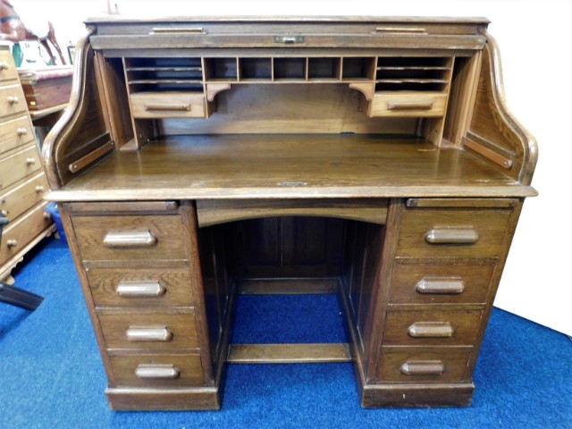 A one piece oak roll top desk, 47in wide x 46in hi