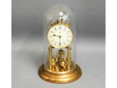 a Schatz glass domed anniversary clock, 12in high