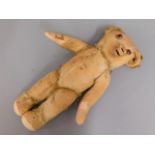 A 1930's Merrythought teddy bear with button ear,