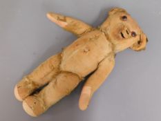 A 1930's Merrythought teddy bear with button ear,