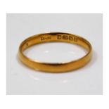 A 22ct gold band, size L/M, 1.9g