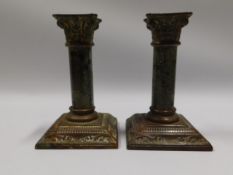 A small pair of bronze & serpentine candle holders