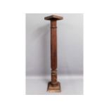 A mahogany torchere, 43in high