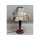 A Tiffany style lamp with coloured glass shade, 23