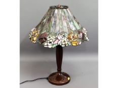 A Tiffany style lamp with coloured glass shade, 23