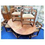 An arts & crafts dining suite with four chairs, ta