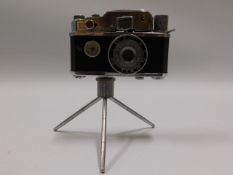 A miniature camera lighter