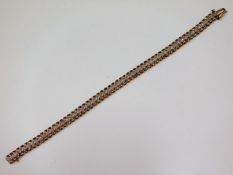 A 9ct gold bracelet set with diamonds, 7.25in long